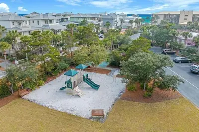 an aerial view of a park with a playground at High Pointe Resort 414 in Rosemary Beach