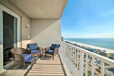 a balcony with chairs and a view of the ocean at Ocean Oasis PCB Condo with Balcony and Beach Views! in Panama City Beach