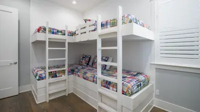 a white room with two bunk beds in it at That Summer Feeling in Inlet Beach