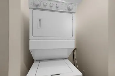 a white stove top oven sitting in a kitchen at Ocean Villa 1102 in Panama City Beach