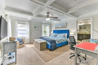 a bedroom with a blue bed and a desk at Half Mi to Inlet Beach Home with Grill and Fire Pit in Inlet Beach