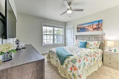 a bedroom with a bed and a dresser and a television at Half Mi to Inlet Beach Home with Grill and Fire Pit in Inlet Beach