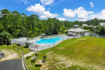 an aerial view of a large backyard with a swimming pool at Seagrove Highlands by Panhandle Getaways in Santa Rosa Beach