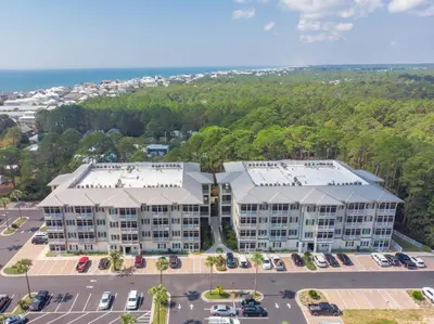 an aerial view of a building with a parking lot at Seagrove Highlands by Panhandle Getaways in Santa Rosa Beach
