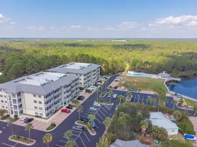 an aerial view of a building with a parking lot at Seagrove Highlands by Panhandle Getaways in Santa Rosa Beach