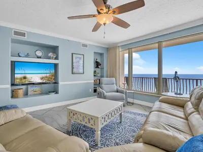 a living room with a view of the ocean at Hidden Dunes 1501 in Panama City Beach