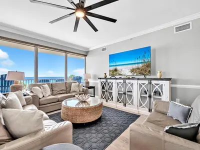 a living room with a couch and a table at Hidden Dunes 305 in Panama City Beach
