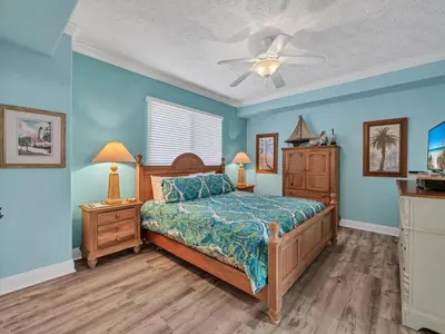 a bedroom with a bed and a ceiling fan at Hidden Dunes 1704 in Panama City Beach