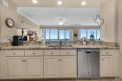 a kitchen with a large sink and a counter top at Hidden Dunes 1703 in Panama City Beach