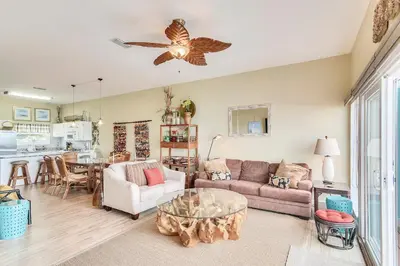a living room with a couch and a table at Seaside Pointe by Book That Condo in Panama City Beach