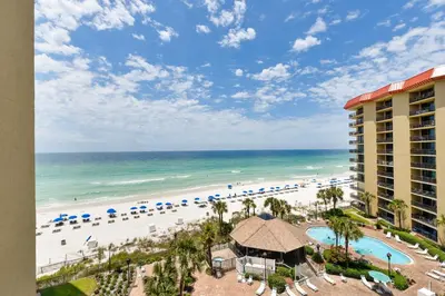 a view of the beach from the balcony of a resort at Summerhouse 710B by Book That Condo in Panama City Beach