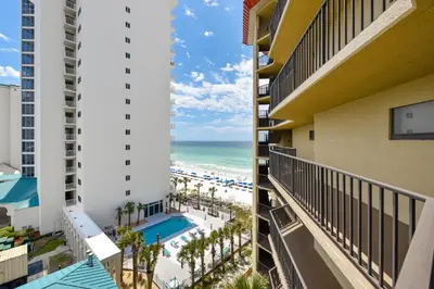 a view of the beach from the balcony of a resort at Summerhouse 710B by Book That Condo in Panama City Beach