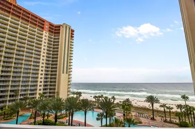 a view of the ocean from the balcony of a resort at Shores of Panama #612 by Book That Condo in Panama City Beach