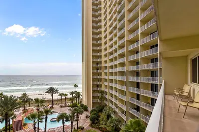 a view of the ocean from the balcony of a resort at Shores of Panama #612 by Book That Condo in Panama City Beach