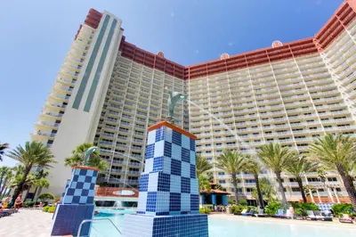a resort with a pool and a large building at Shores of Panama #612 by Book That Condo in Panama City Beach