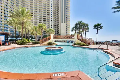 a large swimming pool in front of a large building at Shores of Panama #1217 by Book That Condo in Panama City Beach