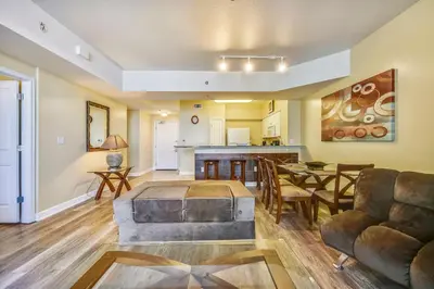 a living room with a couch and a table at Shores of Panama #1217 by Book That Condo in Panama City Beach