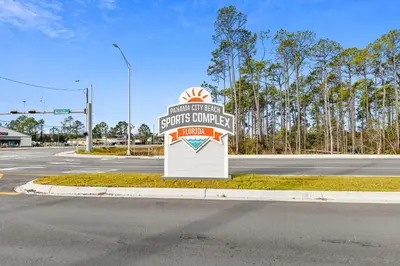 a sign for a store on the side of a road at Shores of Panama #1411 by Book That Condo in Panama City Beach