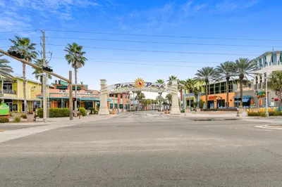 an empty street in a town with palm trees at Shores of Panama #1411 by Book That Condo in Panama City Beach