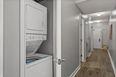 a laundry room with a washer and dryer at Shores of Panama #1502 by Book That Condo in Panama City Beach
