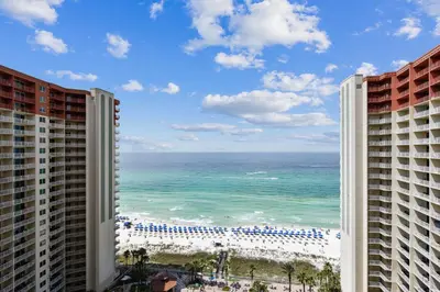 a view of the ocean from the balcony of a resort at Shores of Panama #1714 by Book That Condo in Panama City Beach