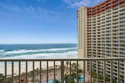 a view of the beach from the balcony of a resort at Shores of Panama #1119 by Book That Condo in Panama City Beach