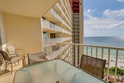 a balcony with chairs and a view of the beach at Shores of Panama #1421 by Book That Condo in Panama City Beach