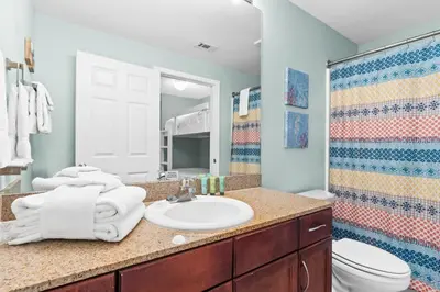 a bathroom with a sink and a toilet at Laketown Wharf Resort #1321 by Book That Condo in Panama City Beach