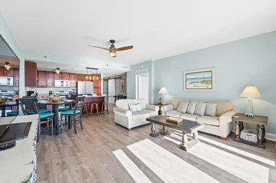 a living room with a couch and a table at Laketown Wharf Resort #1321 by Book That Condo in Panama City Beach