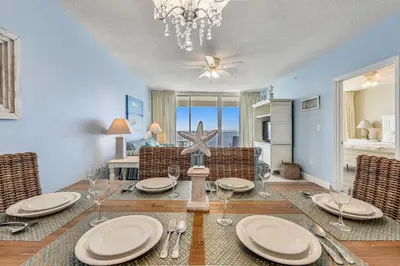 a dining room with a table with a starfish on it at Majestic Beach Resort #1502-1 by Book That Condo in Panama City Beach