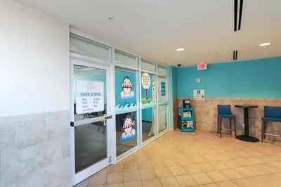 a waiting room with a shark decal on the wall at Majestic Beach Resort #1502-1 by Book That Condo in Panama City Beach