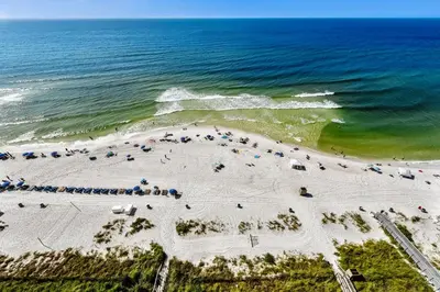 an overhead view of a beach with cars and the ocean at Majestic Beach Resort #1502-1 by Book That Condo in Panama City Beach