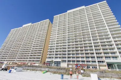 two tall buildings on the beach near the beach at Majestic Beach Resort #1215-1 by Book That Condo in Panama City Beach