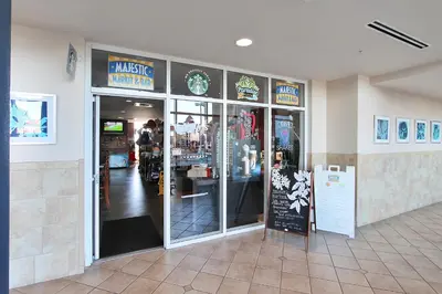 a store front of a music workshop with glass doors at Majestic Beach Resort #1215-1 by Book That Condo in Panama City Beach