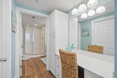 a bathroom with a sink and a mirror at Majestic Beach Resort #1309-2 by Book That Condo in Panama City Beach