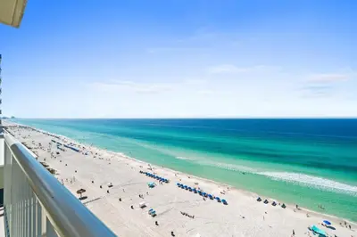 a view of the beach from the balcony of a resort at Majestic Beach Resort #1309-2 by Book That Condo in Panama City Beach