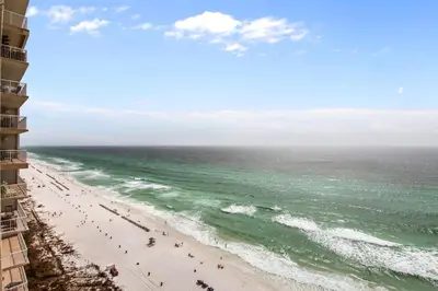 a view of the beach from the balcony of a hotel at Majestic Beach Resort #1613-1 by Book That Condo in Panama City Beach