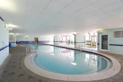 a large swimming pool in a large building at Majestic Beach Resort #1613-1 by Book That Condo in Panama City Beach