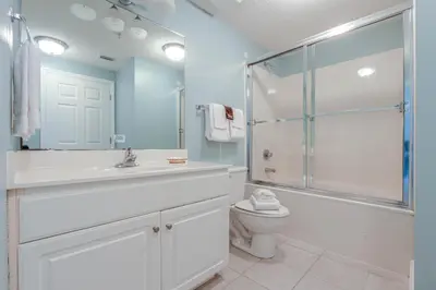 a bathroom with a shower sink and a toilet at Majestic Beach Resort #1613-1 by Book That Condo in Panama City Beach
