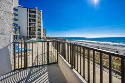 a balcony with a view of the beach at Aquavista Condominiums #206-W by Book That Condo in Panama City Beach