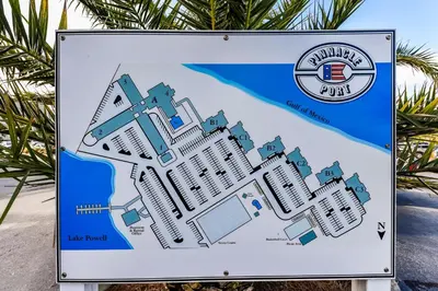 a sign for the beach with a map at Pinnacle Port #115A by Book That Condo in Panama City Beach