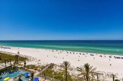 a beach with a lot of people and the ocean at Boardwalk Beach Resort #604 by Book That Condo in Panama City Beach