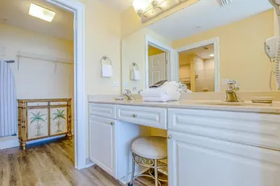 a bathroom with a sink and a mirror at Boardwalk Beach Resort #604 by Book That Condo in Panama City Beach
