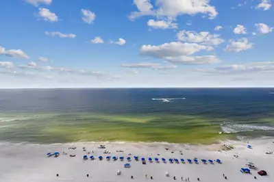 an aerial view of a beach with people and umbrellas at Boardwalk Beach Resort #1605 by Book That Condo in Panama City Beach