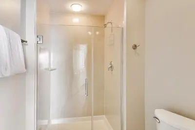a bathroom with a shower with a glass door at Boardwalk Beach Resort #1703 by Book That Condo in Panama City Beach