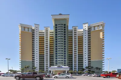 a large building with cars parked in a parking lot at Boardwalk Beach Resort #1802 by Book That Condo in Panama City Beach