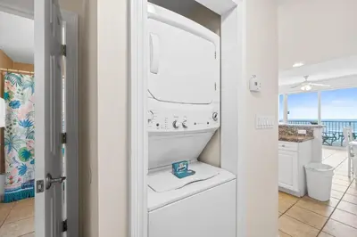a bathroom with a sink and a view of the ocean at Boardwalk Beach Resort #1909 by Book That Condo in Panama City Beach