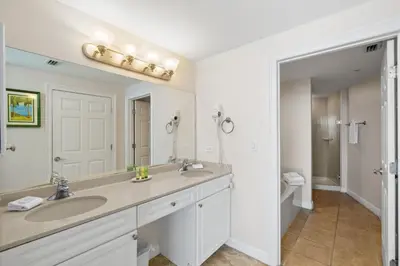 a bathroom with a sink and a mirror at Boardwalk Beach Resort #1909 by Book That Condo in Panama City Beach