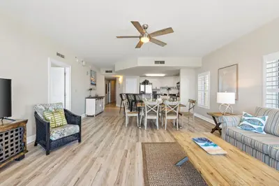a living room with a couch and a table at Calypso Resort and Towers #801-W by Book That Condo in Panama City Beach