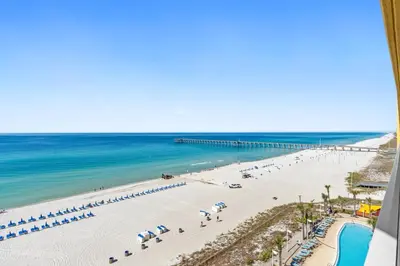a view of a beach with umbrellas and the ocean at Calypso Resort and Towers #801-W by Book That Condo in Panama City Beach